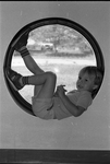 86-10; Early Childhood Center Student in Window by Southern Illinois University Edwardsville